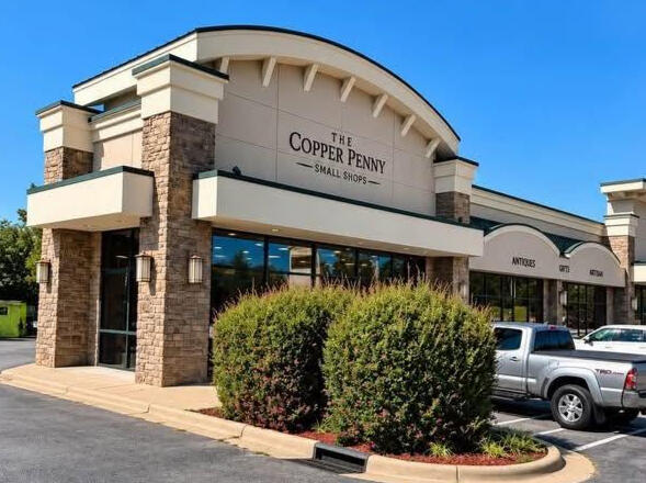 Future building of Copper Penny Small Shops Side parking lot view across from Chic-fil-A